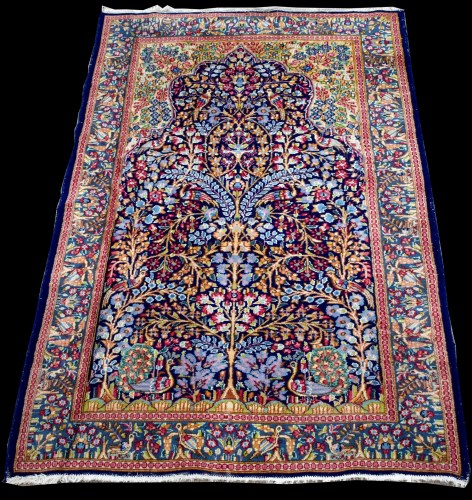 Lot 683 - A Kerman rug, with Tree of Life design within...