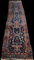 Lot 687 - A Mahal runner, with floral motifs on blue...