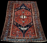 Lot 688 - A Malayer rug, decorated with flowerheads and...