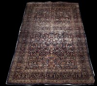 Lot 689 - An antique Tabriz rug, with full floral...