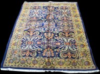 Lot 695 - A Kashan carpet, with floral decoration on a...