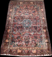 Lot 698 - A Kashan rug, the foliate medallion surrounded...