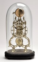 Lot 733 - A brass skeleton clock, with pierced silver...