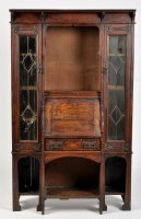 Lot 742 - An Arts & Crafts bureau cabinet, the flared...