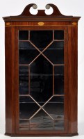 Lot 755 - A George III mahogany hanging corner cabinet,...