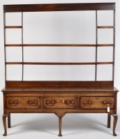 Lot 756 - An 18th Century oak dresser, the delft rack...