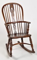 Lot 768 - A 19th Century elm seat Windsor rocking chair,...