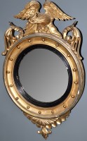 Lot 772 - A Regency giltwood convex mirror, the central...