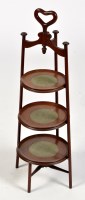 Lot 773 - An Edwardian mahogany three-tier cake stand,...