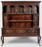 Lot 798 - A 19th Century carved oak dresser, the flared...