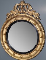 Lot 801 - A Regency giltwood convex wall mirror, the...