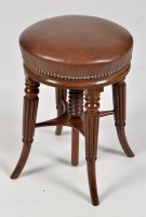 Lot 811 - A William IV rosewood piano stool, the studded...