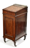 Lot 812 - An early 19th Century rosewood davenport, the...