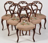 Lot 816 - A set of six Victorian carved mahogany balloon...