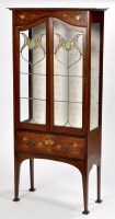 Lot 818 - An Edwardian Art Nouveau mahogany display...