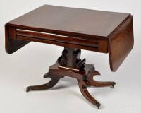 Lot 826 - A Regency mahogany sofa table, the top with...