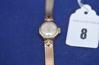 Lot 8 - A 9ct. yellow gold lady's cocktail watch, by...