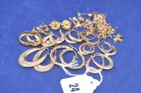 Lot 24 - A quantity of 9ct. yellow gold earrings,...