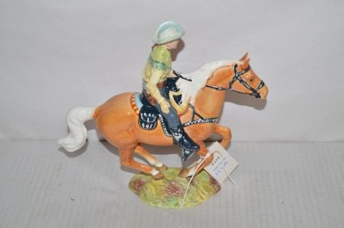 Lot 122 - A Beswick figure of a cowboy riding a horse,