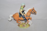 Lot 122A - A Beswick figure of a cowboy riding a horse,...