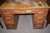Lot 703 - An early 20th Century oak desk fitted nine...