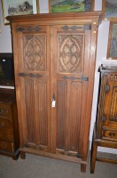 Lot 760 - An early 20th Century carved and stained oak...