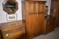 Lot 761 - A three-piece carved and stained oak bedroom...