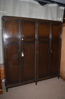 Lot 764 - An early 20th Century dark stained oak four...