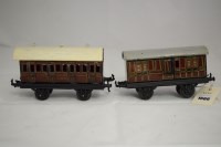 Lot 1566 - Two Bing 0-gauge coaches, one 3rd/1st class,...