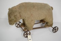 Lot 1722 - An early 20th Century 'pull-along' bear,...