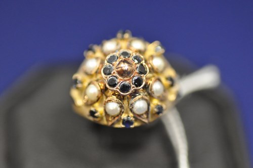 Lot 9 - A sapphire and half pearl dress ring, the...