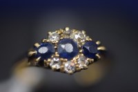Lot 34 - A sapphire and diamond ring, the three...