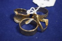 Lot 38 - Four 9ct. yellow gold rings, one set with...