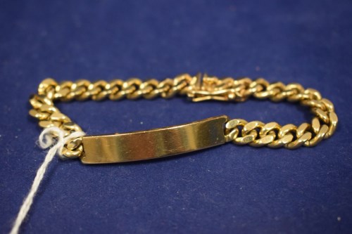 Lot 46 - A 9ct. yellow gold identity bracelet, of curb...