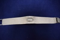 Lot 49 - A 9ct. white gold Rotary bracelet/cocktail...