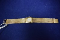 Lot 51 - A 9ct. yellow gold cased Nivada cocktail watch,...