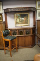 Lot 729 - A Reproduction heavily carved and stained oak...