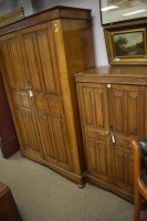 Lot 730 - A gent's large carved and stained oak wardrobe,...