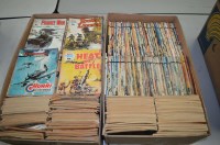 Lot 1589 - A large collection of Commando war comic books;...