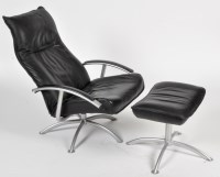 Lot 1017 - A modern black leather and grey metal armchair...