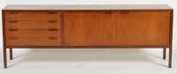 Lot 1025 - A mid 20th Century teak sideboard, probably...