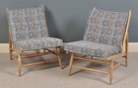 Lot 1047 - A pair of Ercol beechwood easy chairs.