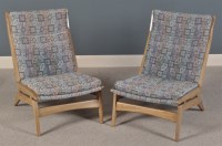 Lot 1052 - A pair of mid 20th Century easy chairs,...