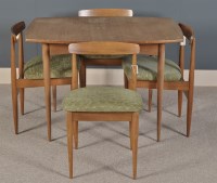 Lot 1053 - A mid 20th Century dining table, shaped...