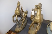 Lot 288 - A pair of brass Marley horses with attendants,...