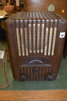 Lot 297 - An Art Deco Pye radio in bakelite case, 40cms...