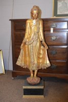 Lot 336 - A gilt plaster figure of an Asian deity on...