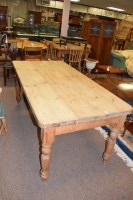 Lot 559 - A modern rectangular pine kitchen table, the...
