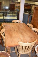 Lot 579 - A modern pine kitchen dining table with plank...