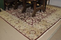Lot 606 - A Ziegler carpet with floral decoration on a...